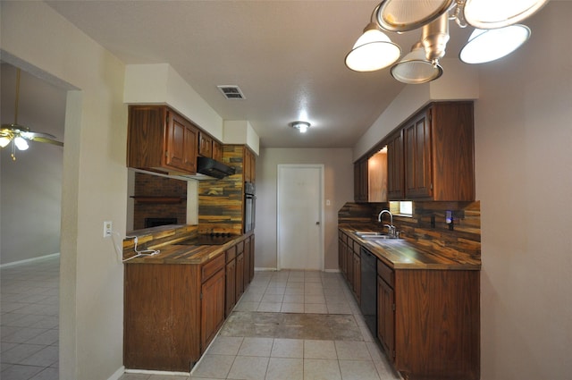 40103 Mill Creek Rd, Magnolia, TX 77354 - kitchen featuring light tile patterned floors, decorative backsplash, black appliances, a sink, and dark countertops