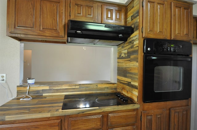 40103 Mill Creek Rd, Magnolia, TX 77354 - kitchen featuring black appliances, range hood, and brown cabinets