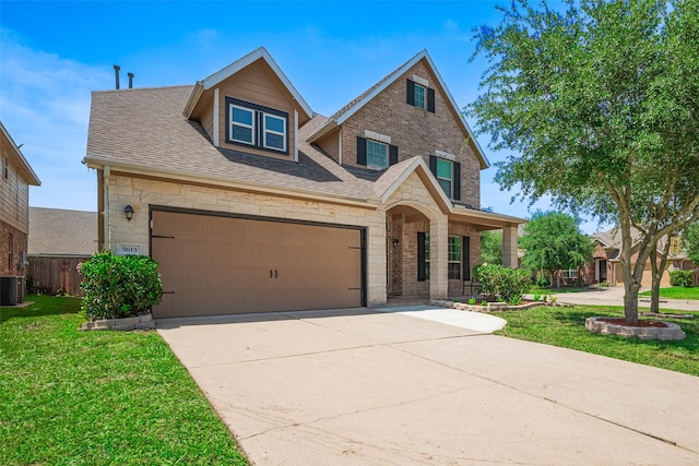 5615 Gemstone Park Rd, Richmond, TX 77407 - view of front of house with stone siding, concrete driveway, cooling unit, a porch, and a shingled roof