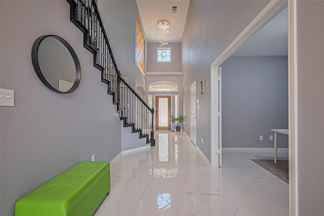 5615 Gemstone Park Rd, Richmond, TX 77407 - entrance foyer with stairs, a high ceiling, marble finish floors, baseboards, and a chandelier
