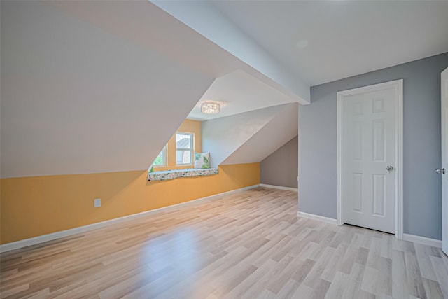 5615 Gemstone Park Rd, Richmond, TX 77407 - bonus room featuring wood finished floors, vaulted ceiling, and baseboards