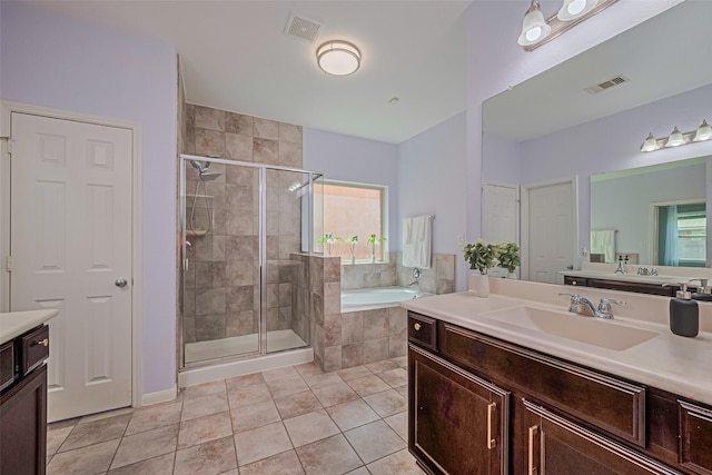 5615 Gemstone Park Rd, Richmond, TX 77407 - full bathroom featuring vanity, a garden tub, a stall shower, and healthy amount of natural light