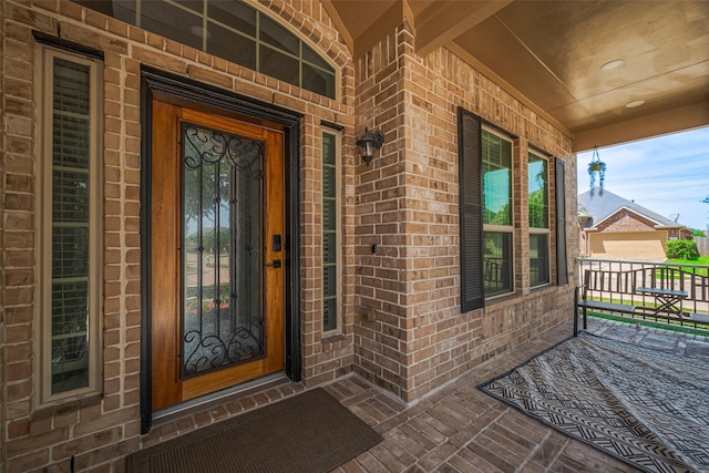 5615 Gemstone Park Rd, Richmond, TX 77407 - property entrance featuring a porch and brick siding