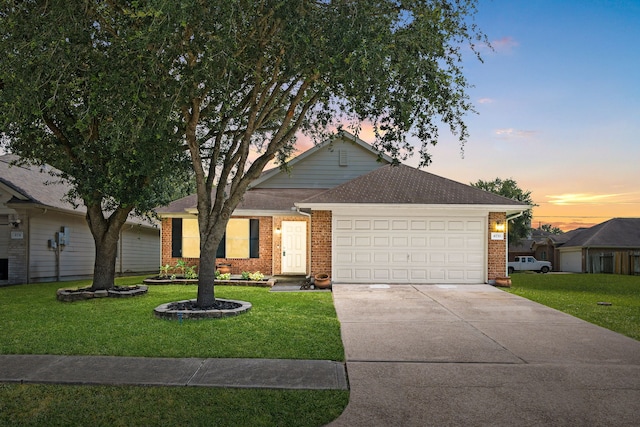 6733 Hidden Colony Ln, Dickinson, TX 77539 - ranch-style home with brick siding, an attached garage, driveway, a front yard, and roof with shingles