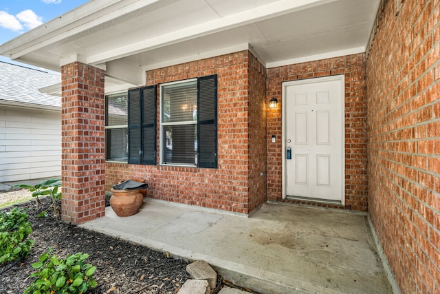 6733 Hidden Colony Ln, Dickinson, TX 77539 - doorway to property featuring brick siding
