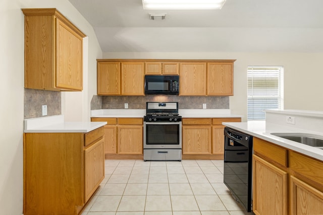6733 Hidden Colony Ln, Dickinson, TX 77539 - kitchen featuring black appliances, tasteful backsplash, light countertops, light tile patterned floors, and lofted ceiling
