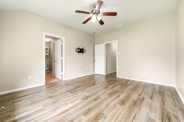 6733 Hidden Colony Ln, Dickinson, TX 77539 - unfurnished bedroom with light wood-type flooring, ensuite bath, baseboards, ceiling fan, and vaulted ceiling