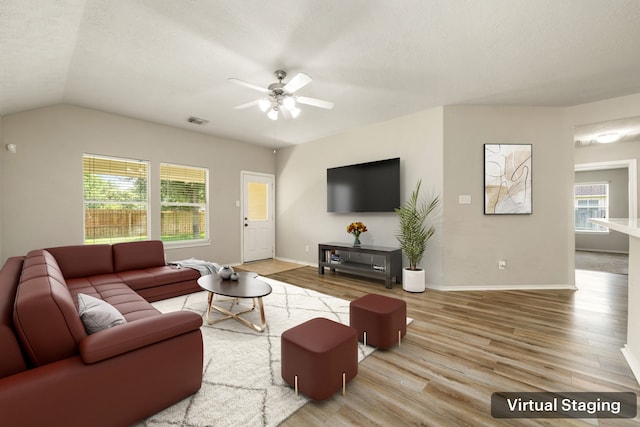 6733 Hidden Colony Ln, Dickinson, TX 77539 - living area with wood finished floors, a ceiling fan, plenty of natural light, baseboards, and vaulted ceiling