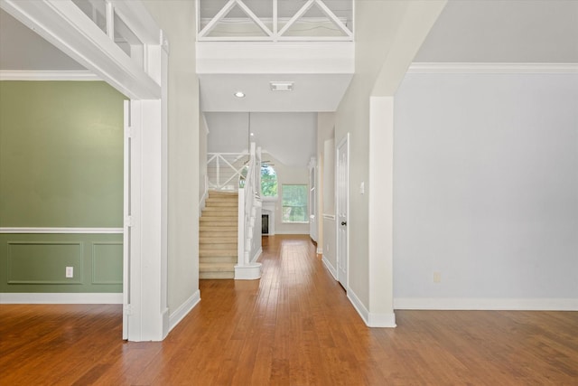 5122 Hidden Brook Ln, League City, TX 77573 - corridor featuring hardwood / wood-style floors, stairs, baseboards, and wainscoting