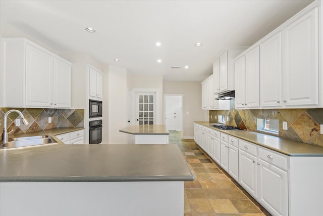 5122 Hidden Brook Ln, League City, TX 77573 - kitchen featuring a sink, black appliances, under cabinet range hood, light stone finish flooring, and recessed lighting