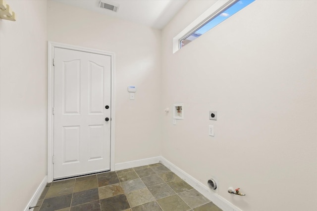 5122 Hidden Brook Ln, League City, TX 77573 - laundry room featuring gas dryer hookup, washer hookup, hookup for an electric dryer, stone finish floors, and baseboards