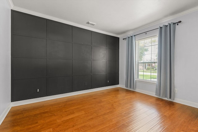 5122 Hidden Brook Ln, League City, TX 77573 - unfurnished room featuring light wood-style floors, baseboards, and crown molding
