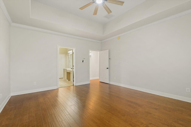 5122 Hidden Brook Ln, League City, TX 77573 - empty room with a ceiling fan, light wood-type flooring, a tray ceiling, baseboards, and crown molding