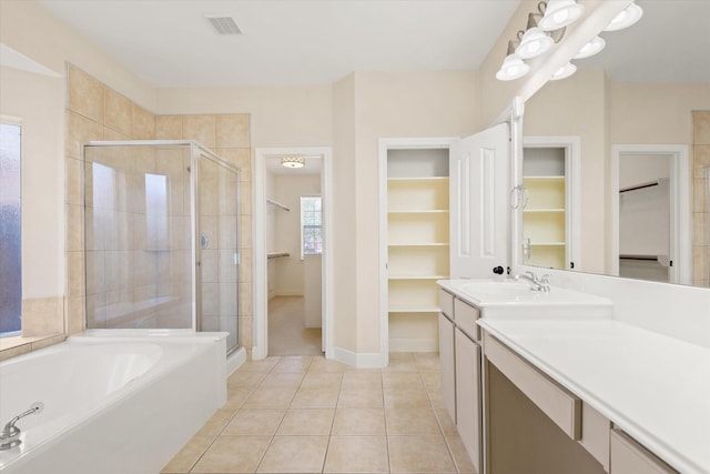5122 Hidden Brook Ln, League City, TX 77573 - bathroom with a spacious closet, a shower stall, vanity, and tile patterned floors