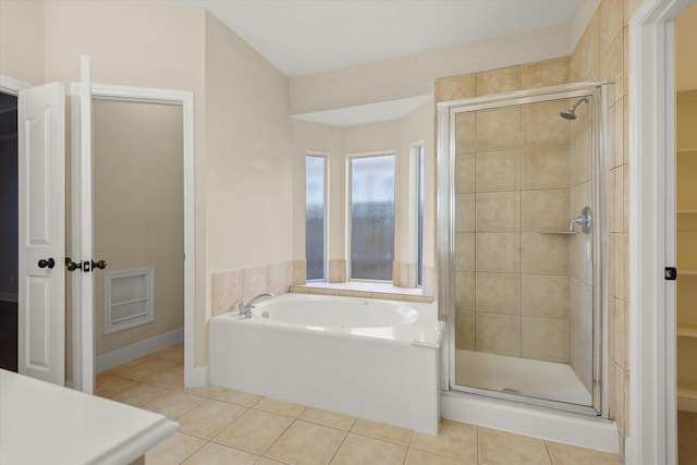 5122 Hidden Brook Ln, League City, TX 77573 - full bath featuring a shower stall, tile patterned floors, a garden tub, and a walk in closet