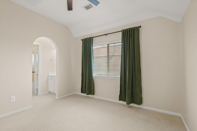 5122 Hidden Brook Ln, League City, TX 77573 - unfurnished room featuring vaulted ceiling, arched walkways, a ceiling fan, carpet flooring, and baseboards