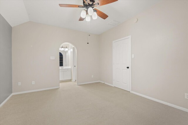 5122 Hidden Brook Ln, League City, TX 77573 - empty room with a ceiling fan, light carpet, baseboards, arched walkways, and lofted ceiling
