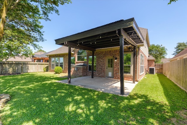 5122 Hidden Brook Ln, League City, TX 77573 - rear view of house with brick siding, central air condition unit, and a patio area