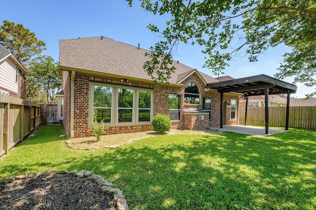 5122 Hidden Brook Ln, League City, TX 77573 - back of house with brick siding, a patio area, and roof with shingles