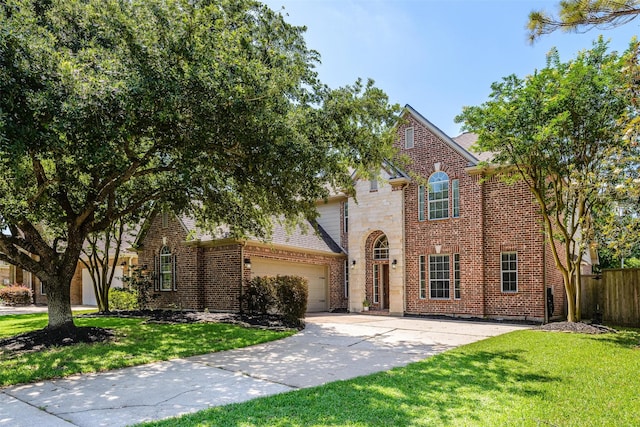 5122 Hidden Brook Ln, League City, TX 77573 - traditional-style home featuring driveway, a garage, brick siding, roof with shingles, and stone siding