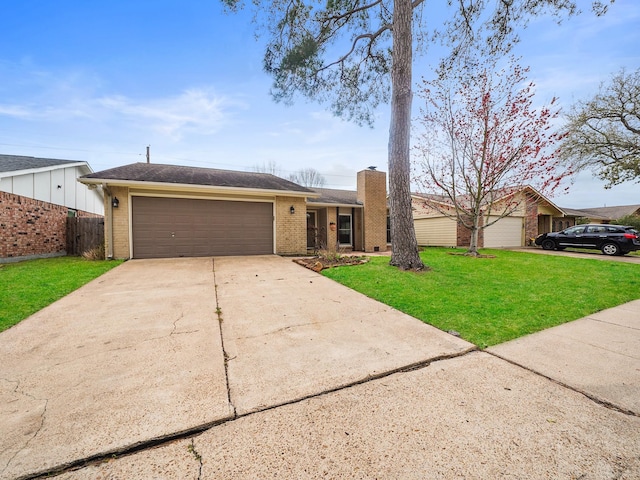 5402 Girnigoe Dr, Houston, TX 77084 - view of front of home with concrete driveway, an attached garage, brick siding, and a chimney