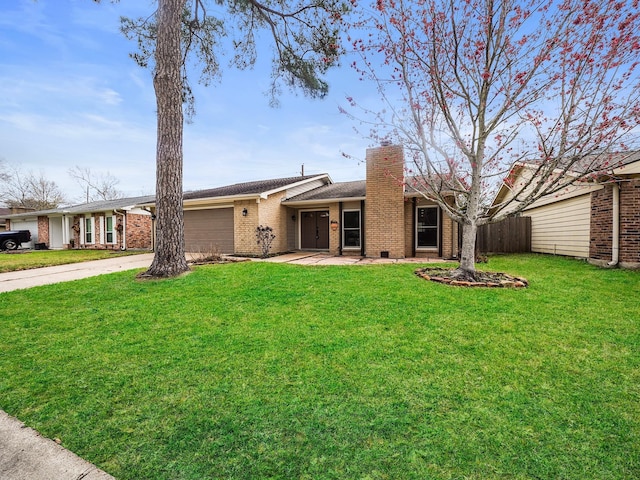 5402 Girnigoe Dr, Houston, TX 77084 - view of front of property featuring concrete driveway, a chimney, an attached garage, and brick siding