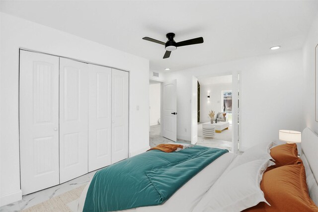 6035 Cartagena St, Houston, TX 77035 - bedroom with light marble finish floors, a closet, recessed lighting, a ceiling fan, and ensuite bathroom