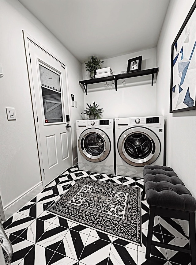 6035 Cartagena St, Houston, TX 77035 - laundry area featuring washing machine and clothes dryer, tile patterned floors, and baseboards