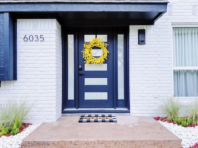 6035 Cartagena St, Houston, TX 77035 - doorway to property with brick siding