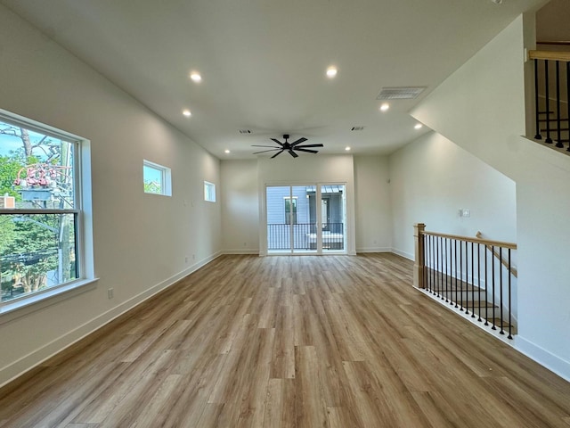 1631 Beall St, Houston, TX 77008 - unfurnished living room with light wood-style floors, recessed lighting, baseboards, and ceiling fan