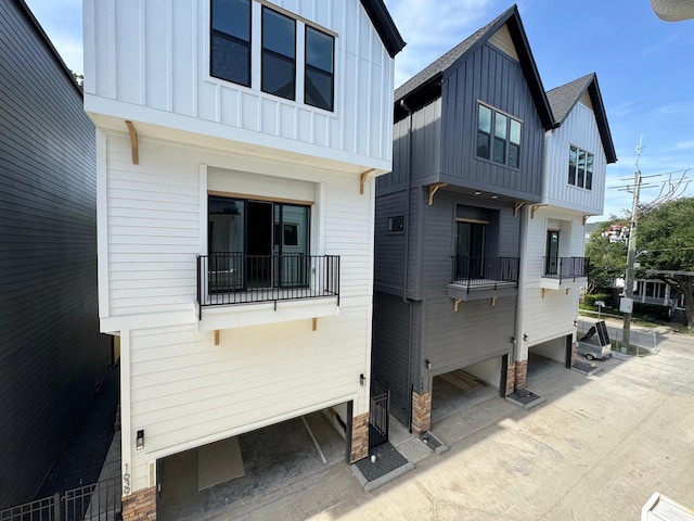 1631 Beall St, Houston, TX 77008 - back of house featuring board and batten siding