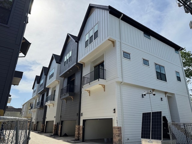 1631 Beall St, Houston, TX 77008 - view of home's exterior with board and batten siding and an attached garage