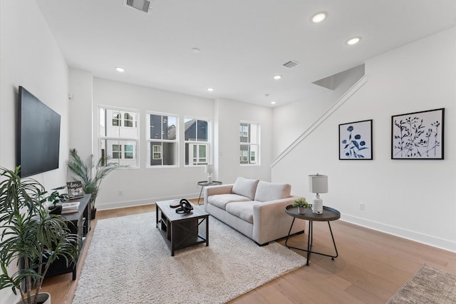 8303 Springwood Creek Ln, Houston, TX 77055 - living room featuring wood finished floors and recessed lighting