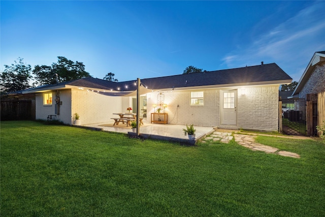 14022 Roundstone Ln, Houston, TX 77015 - back of property featuring brick siding, a patio area, and central AC unit