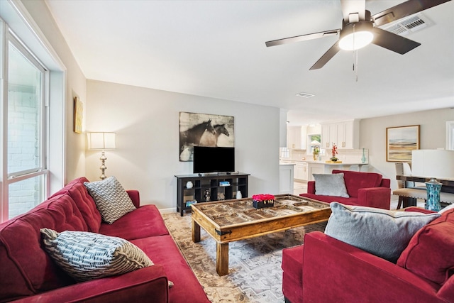 14022 Roundstone Ln, Houston, TX 77015 - living area featuring ceiling fan, carpet flooring, and baseboards