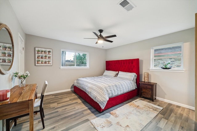14022 Roundstone Ln, Houston, TX 77015 - bedroom featuring wood finished floors, baseboards, and a ceiling fan