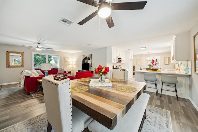 14022 Roundstone Ln, Houston, TX 77015 - dining area with a ceiling fan, wood finished floors, and baseboards