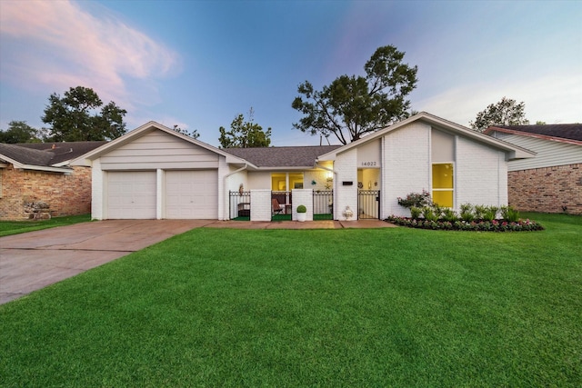 14022 Roundstone Ln, Houston, TX 77015 - view of front of home with brick siding, an attached garage, concrete driveway, and a gate
