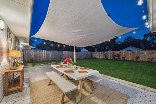 14022 Roundstone Ln, Houston, TX 77015 - patio at twilight with a patio area and outdoor dining area