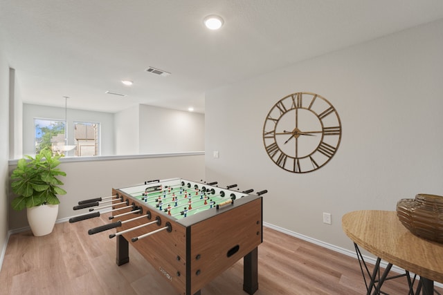 8957 Monterey View Dr, Houston, TX 77080 - rec room with wood finished floors, baseboards, and recessed lighting