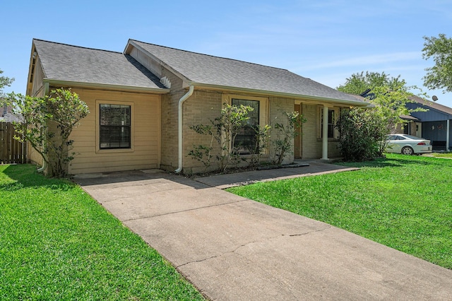 16243 Knollridge Ct, Houston, TX 77053 - ranch-style house featuring roof with shingles, a front lawn, brick siding, and concrete driveway