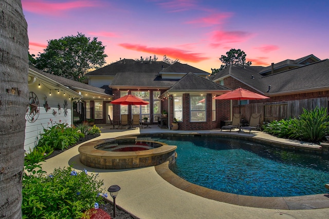 11802 Guernsey Dr, Tomball, TX 77377 - view of swimming pool featuring a patio area, fence, and a pool with connected hot tub