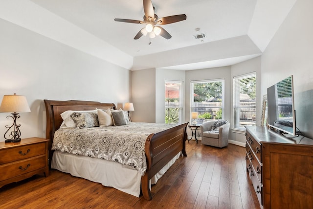 11802 Guernsey Dr, Tomball, TX 77377 - bedroom featuring dark wood-type flooring, a ceiling fan, and baseboards
