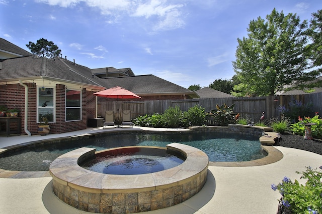 11802 Guernsey Dr, Tomball, TX 77377 - view of swimming pool with a pool with connected hot tub, a fenced backyard, and a patio area