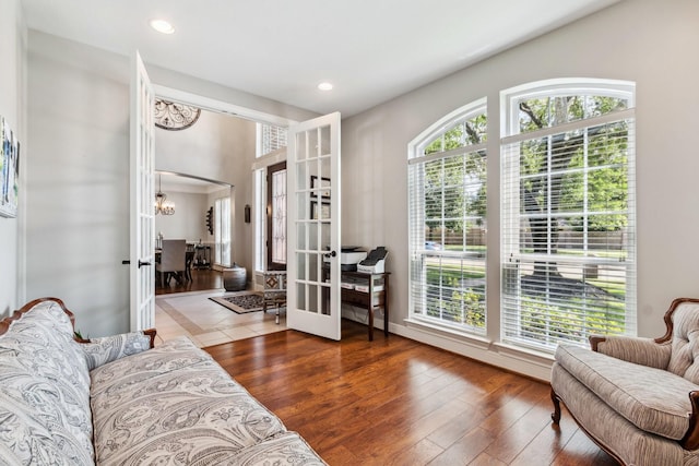 11802 Guernsey Dr, Tomball, TX 77377 - living area with french doors, a chandelier, wood-type flooring, and recessed lighting