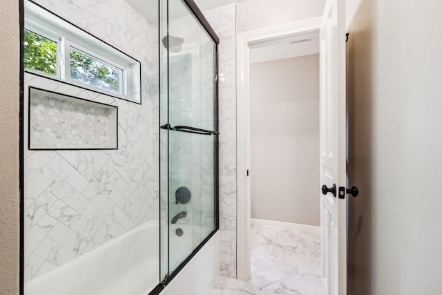 11802 Guernsey Dr, Tomball, TX 77377 - bathroom featuring marble finish flooring, bath / shower combo with glass door, and baseboards