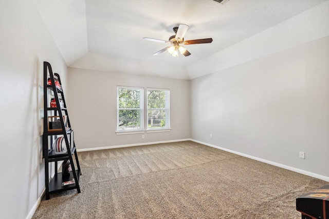 11802 Guernsey Dr, Tomball, TX 77377 - empty room featuring a ceiling fan, carpet floors, baseboards, and lofted ceiling