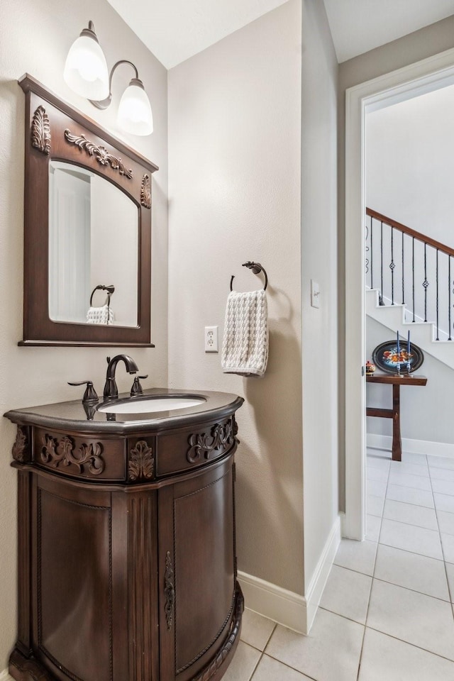 11802 Guernsey Dr, Tomball, TX 77377 - bathroom with tile patterned flooring, baseboards, and vanity