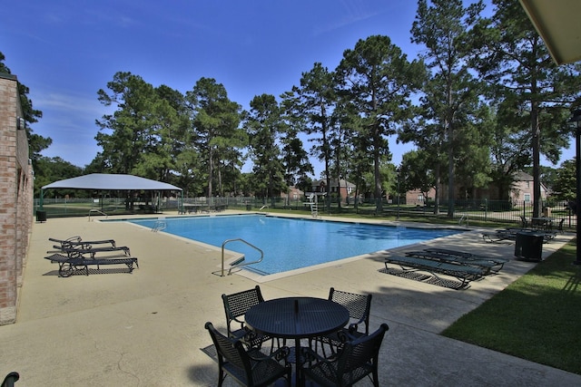 11802 Guernsey Dr, Tomball, TX 77377 - community pool featuring fence and a patio area