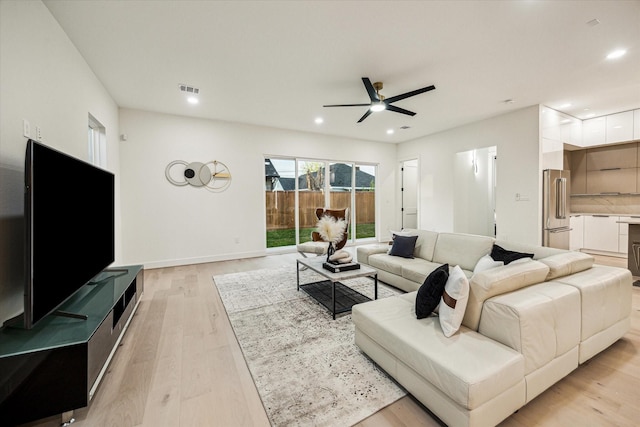 709 Moody St, Houston, TX 77009 - living room with a ceiling fan, light wood-type flooring, recessed lighting, and baseboards